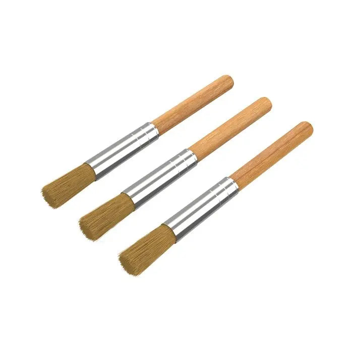 Three Storz and Bickel wooden-handled brushes with bristle heads on a white background