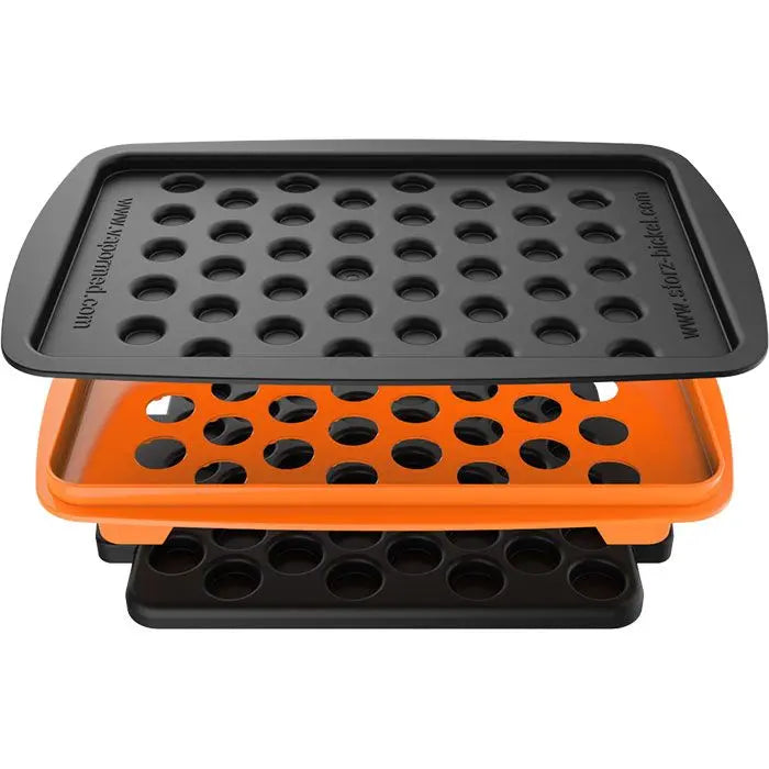 Two black and orange silicone filling trays with round holes on a white background