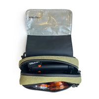 An open olive green and black Vaultlax zippered travel pouch with a silver reflective inner flap, shown on a white background. Inside, a Mighty Plus Medic device and an orange-brown dosing capsule magazine are partially visible.