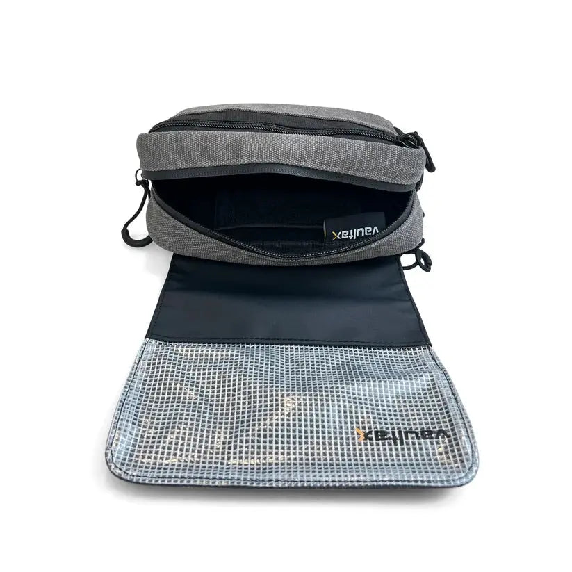 A gray and black mesh organizer pouch shown open, revealing its interior compartments and a clear mesh lower section with a visible Vaultlax logo, on a white background.