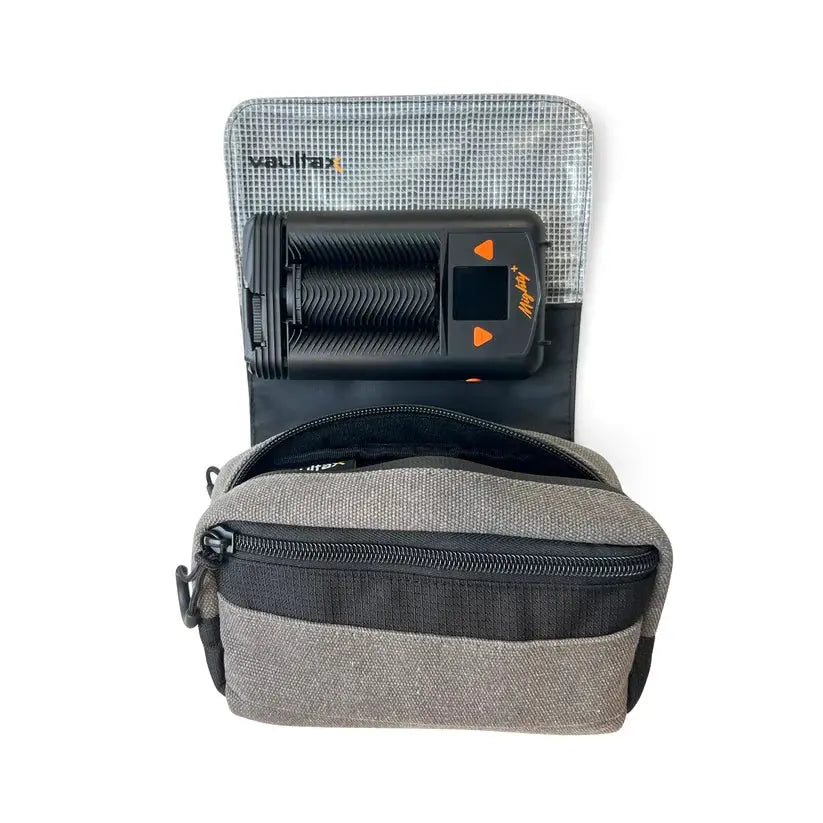A gray and black Mighty Plus Medic portable device shown inside its zippered carrying case against a white background.