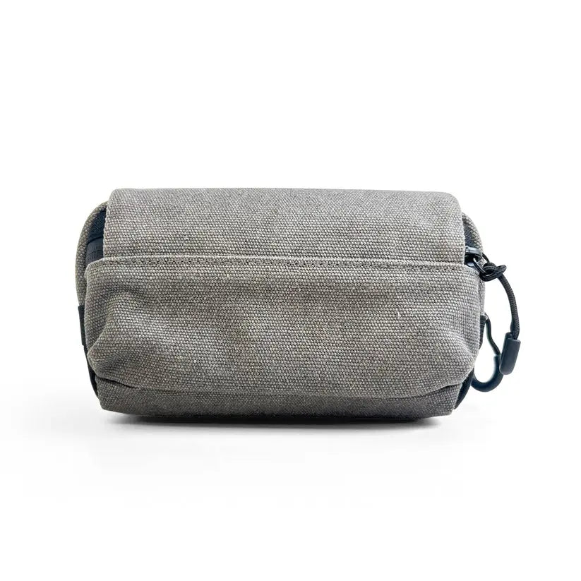 A gray textured canvas Vaultlax pouch with a black strap and carabiner clip, shown against a plain white background.